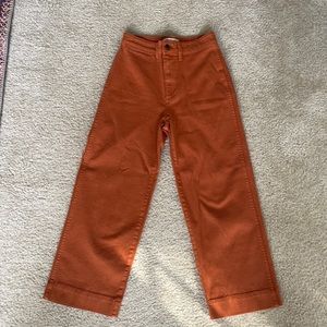 Madewell Slim Emmett Wide-Leg Crop. 98% cotton/2% elastane. Burnt orange/ochre.